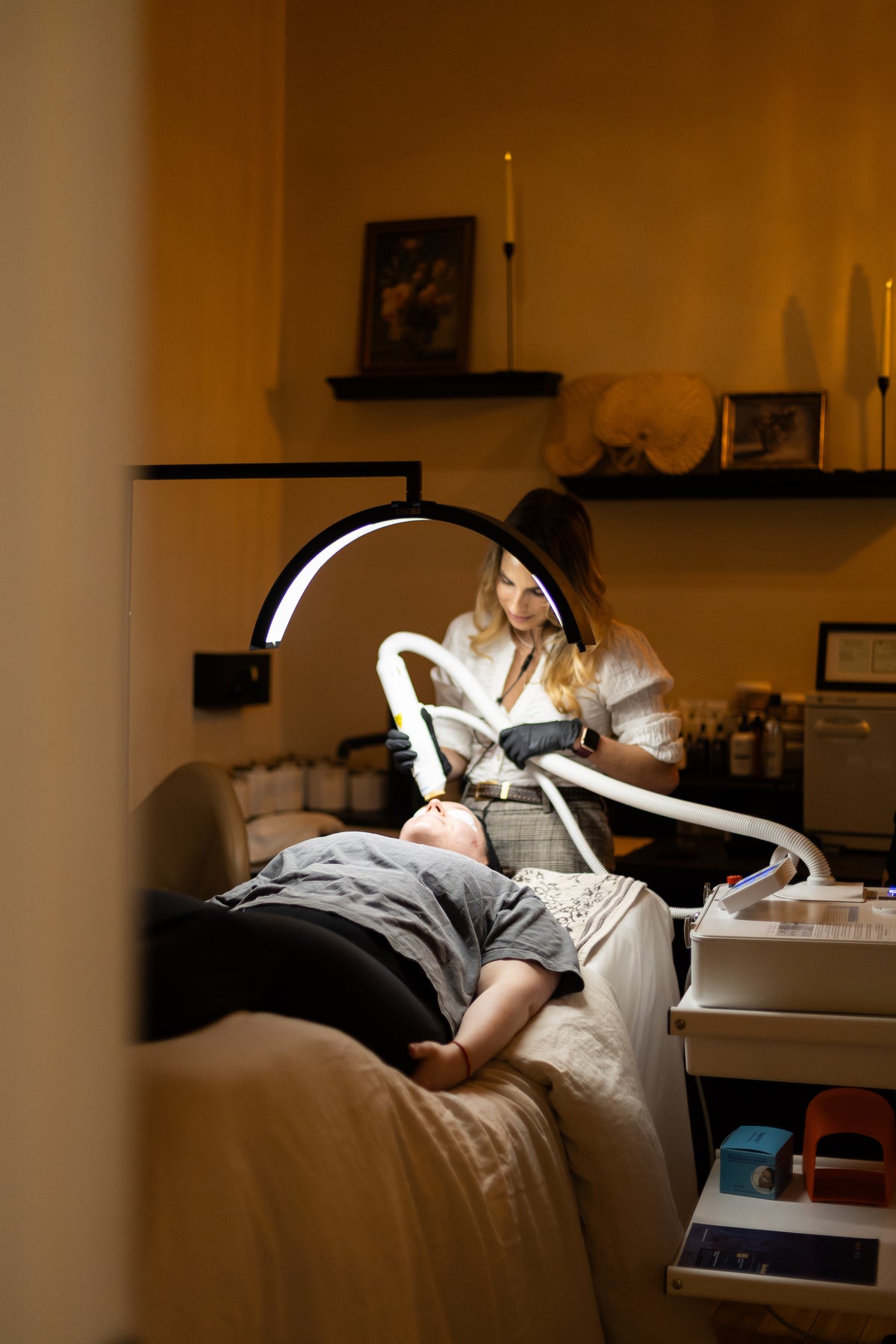 A VELA provider treating a client with the Aerolase laser