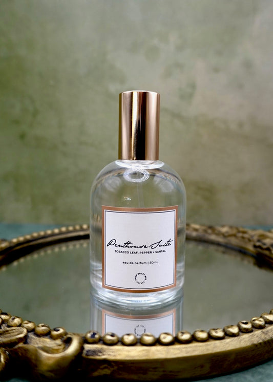 Bailey Bee Penthouse Suite Eau de Parfum 50ml bottle, notes of tobacco leaf, bergamot, cocoa blossom, sandalwood, amber woods and vanilla bean