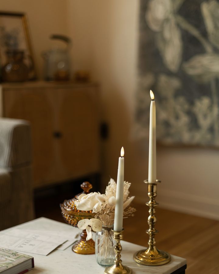 Brass candlesticks and amber glass on the lounge table